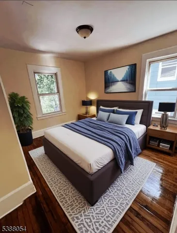 a bedroom with bed and window