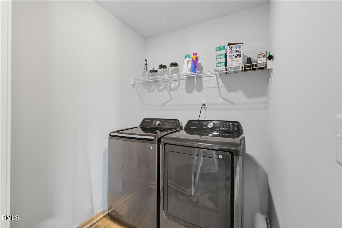 6854 Summerside Drive Whitsett, NC 27377 - Photo 22 of 49 a view of storage and utility room with racks on the wall