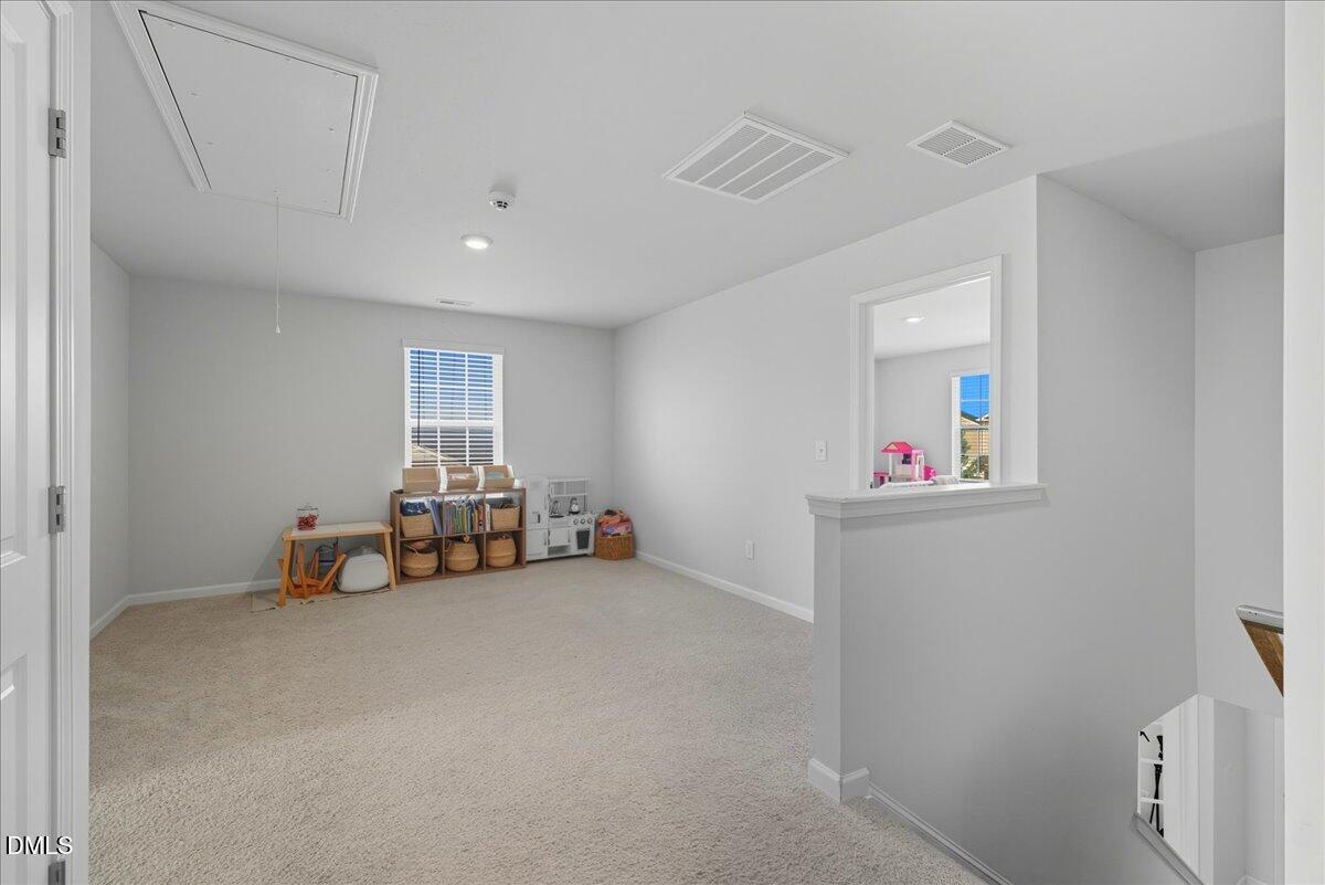 6854 Summerside Drive Whitsett, NC 27377 - Photo 23 of 49 a view of a livingroom with toys