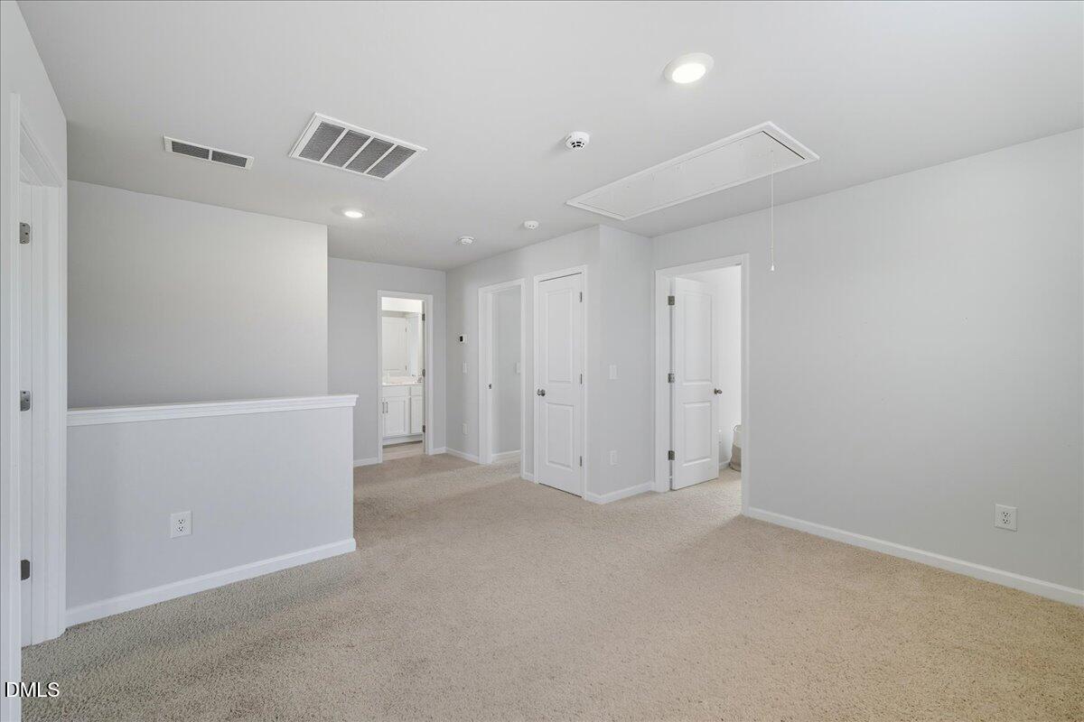 6854 Summerside Drive Whitsett, NC 27377 - Photo 26 of 49 a view of an empty room