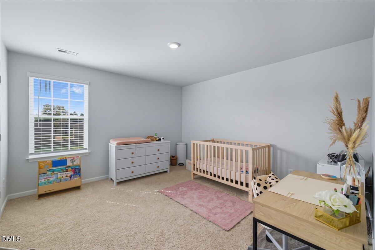 6854 Summerside Drive Whitsett, NC 27377 - Photo 29 of 49 a view of a room with furniture and window