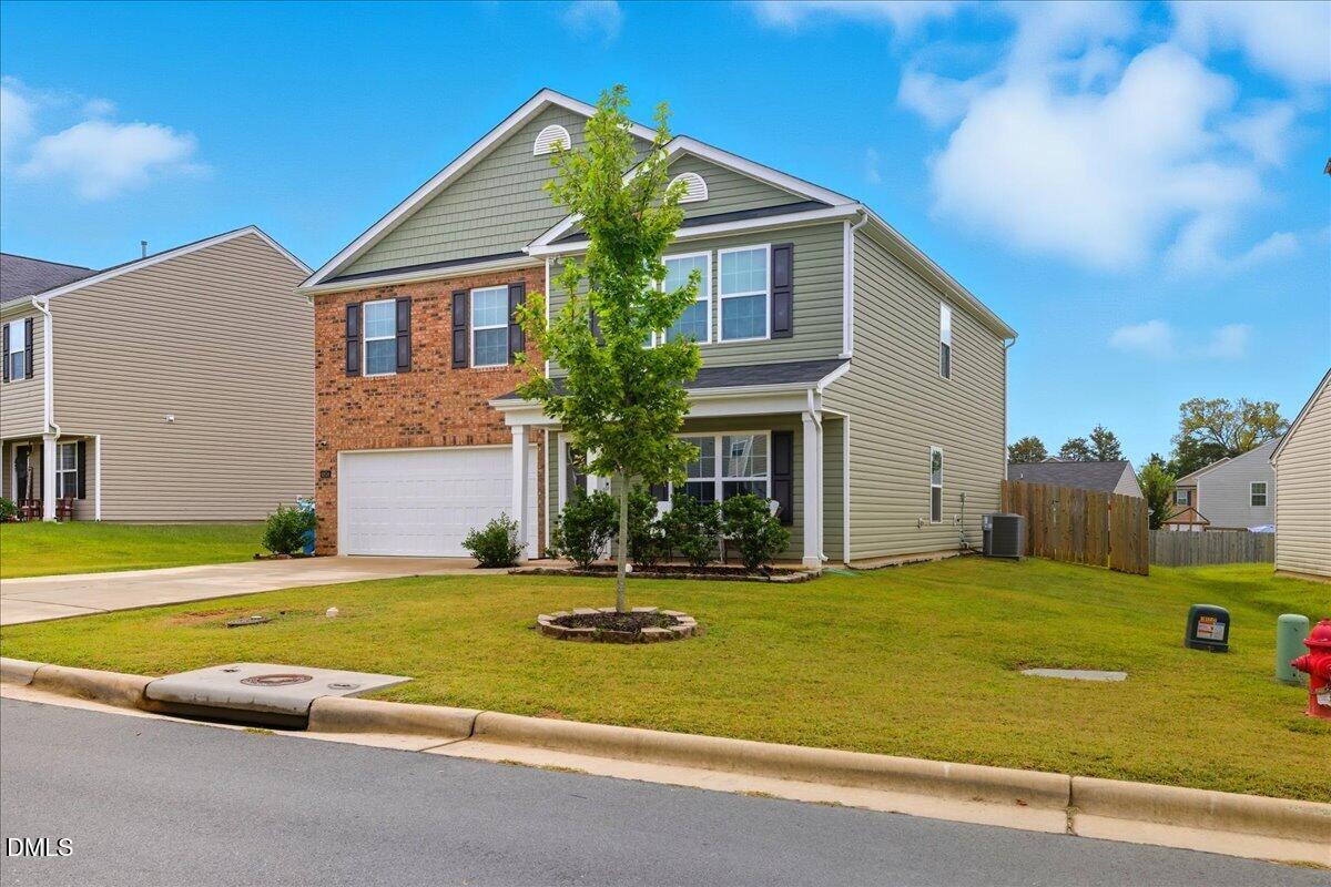 6854 Summerside Drive Whitsett, NC 27377 - Photo 3 of 49 a view of a house with a swimming pool