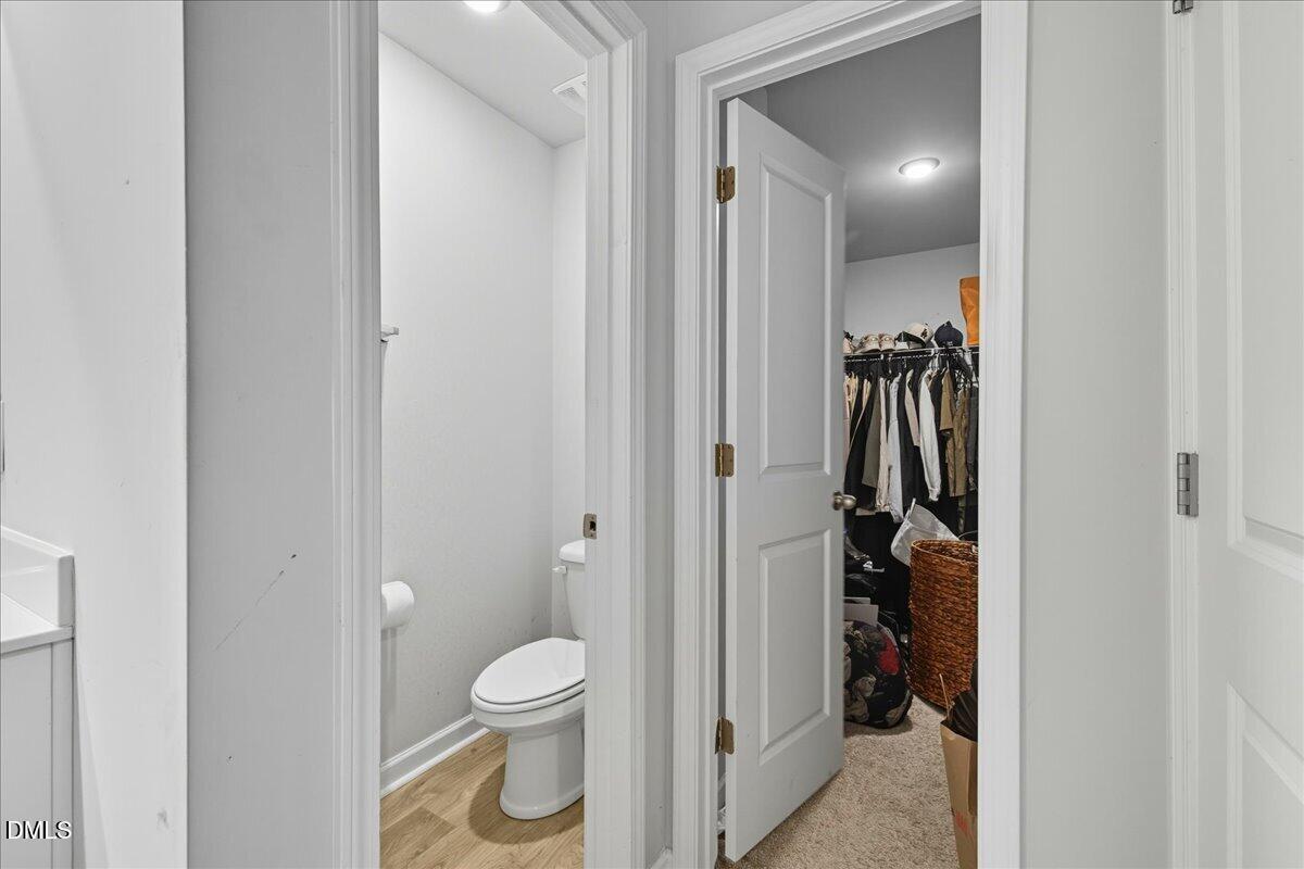 6854 Summerside Drive Whitsett, NC 27377 - Photo 39 of 49 a bathroom with a toilet and a shower