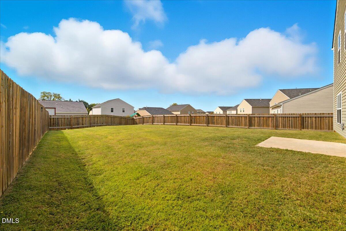 6854 Summerside Drive Whitsett, NC 27377 - Photo 40 of 49 a view of an ocean & house
