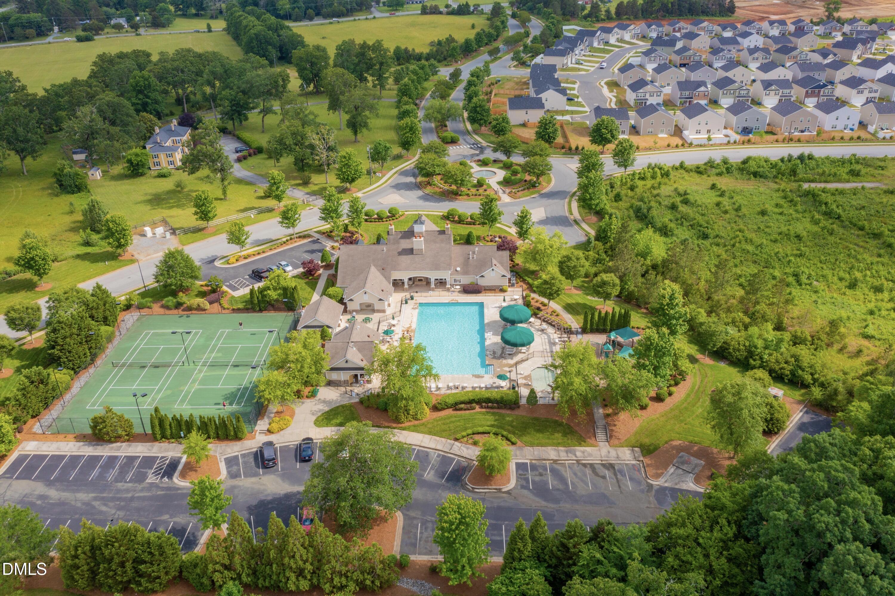 6854 Summerside Drive Whitsett, NC 27377 - Photo 45 of 49 an aerial view of residential houses with outdoor space and trees all around