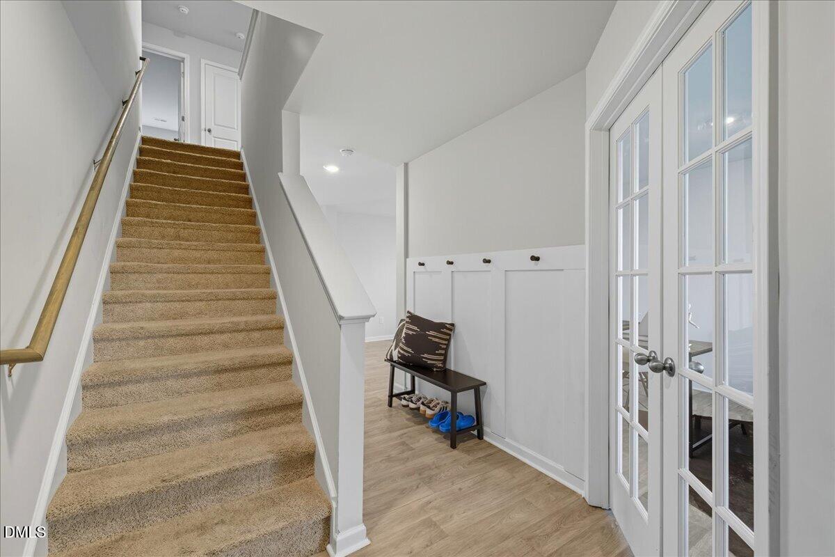 6854 Summerside Drive Whitsett, NC 27377 - Photo 6 of 49 a view of a hallway with staircase