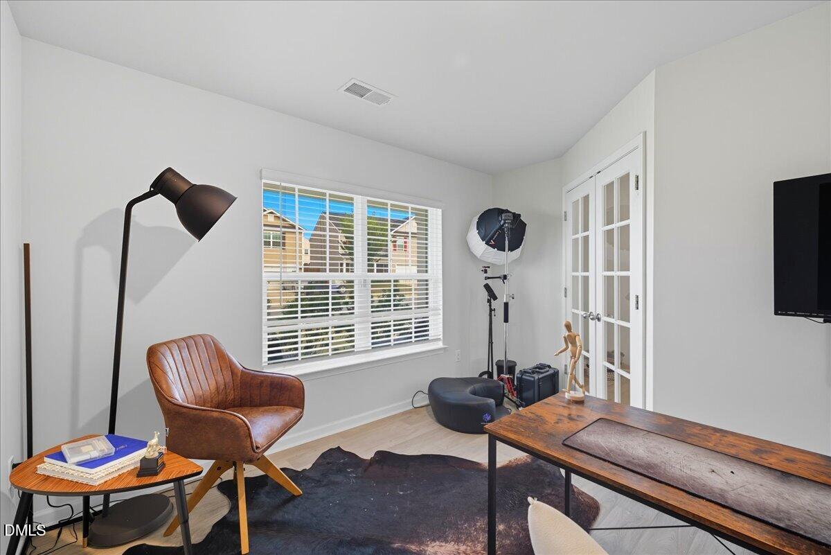 6854 Summerside Drive Whitsett, NC 27377 - Photo 8 of 49 a room with furniture and a window