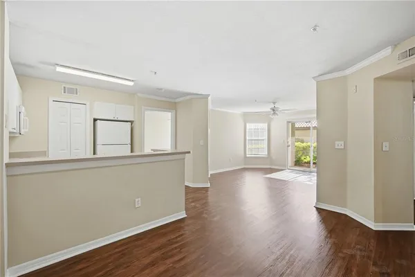 a room with wooden floor and window