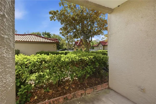 an aerial view of residential houses with outdoor space and swimming pool