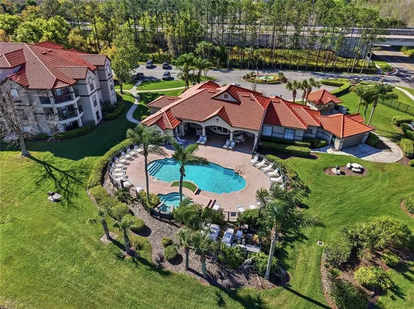 an aerial view of a house with a lake view