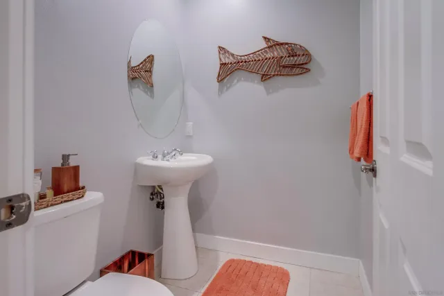 a bathroom with a sink a mirror and a shower