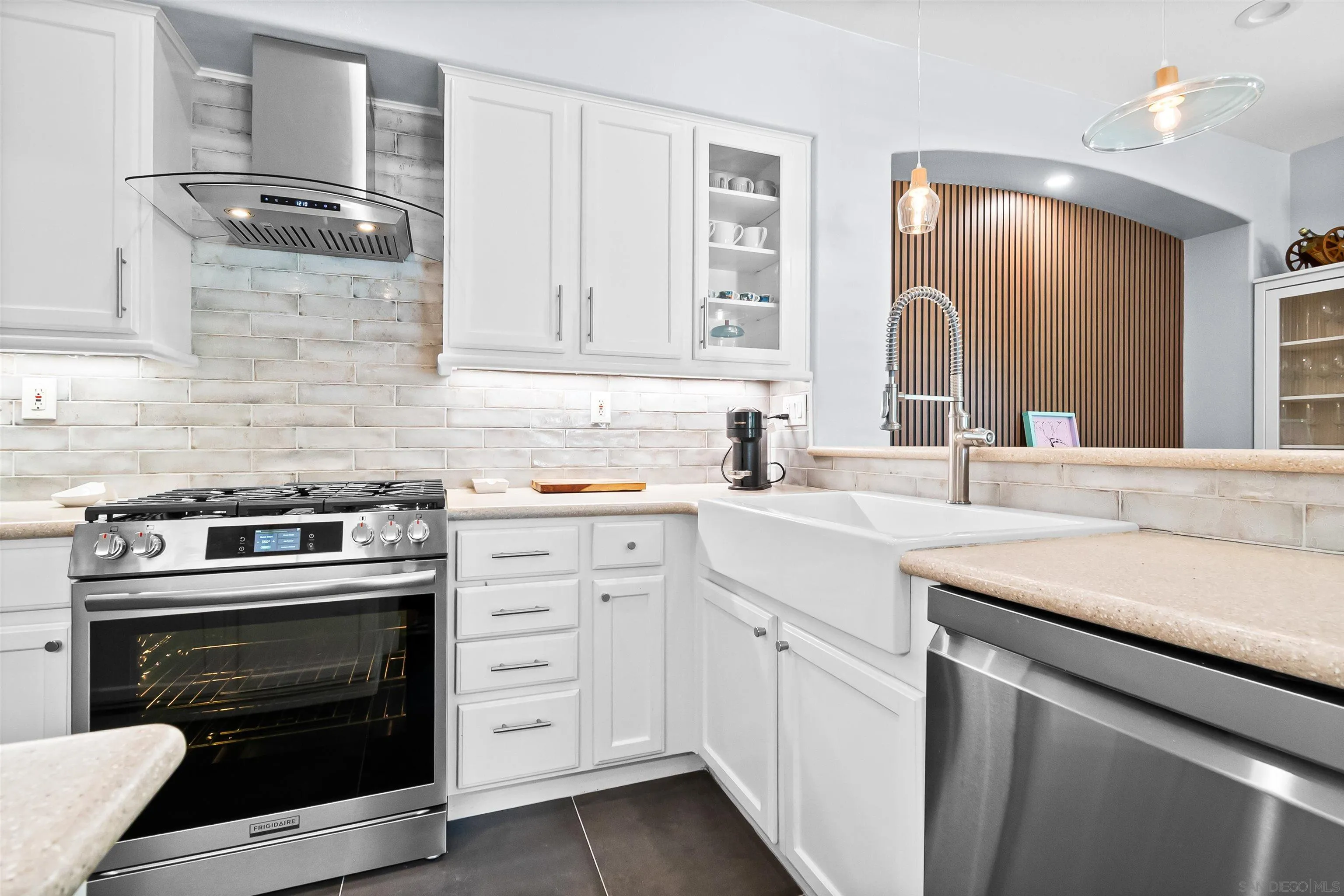 1184 Highbluff Avenue San Marcos, CA 92078 - Photo 16 of 63 a kitchen with white cabinets and appliances