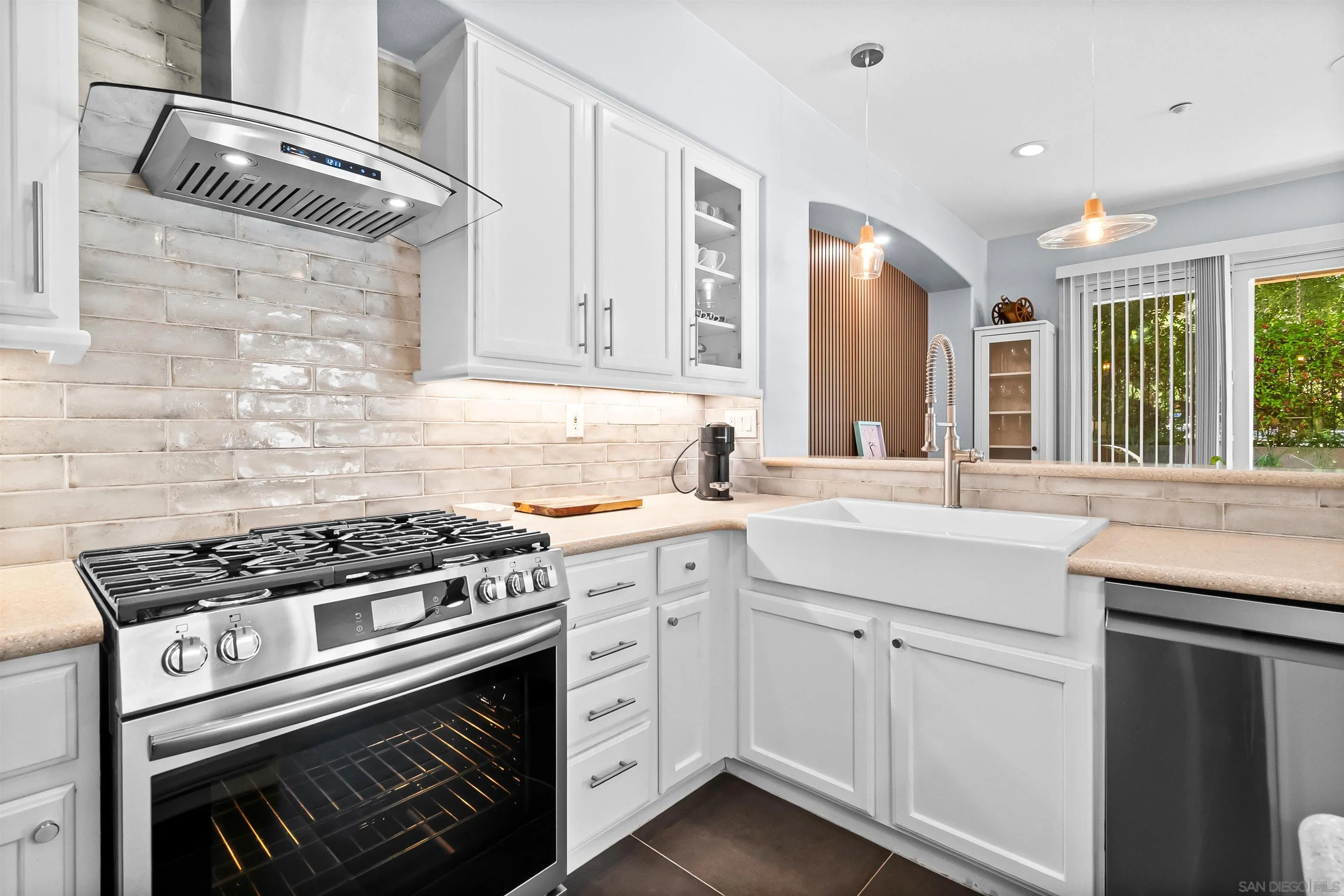 1184 Highbluff Avenue San Marcos, CA 92078 - Photo 18 of 63 a kitchen with cabinets appliances and a window