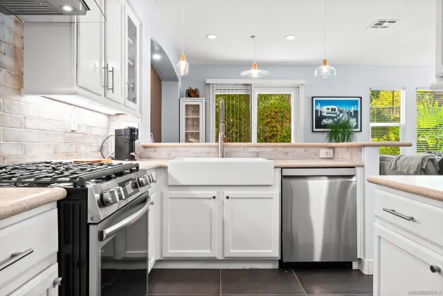 a kitchen with a stove and a sink