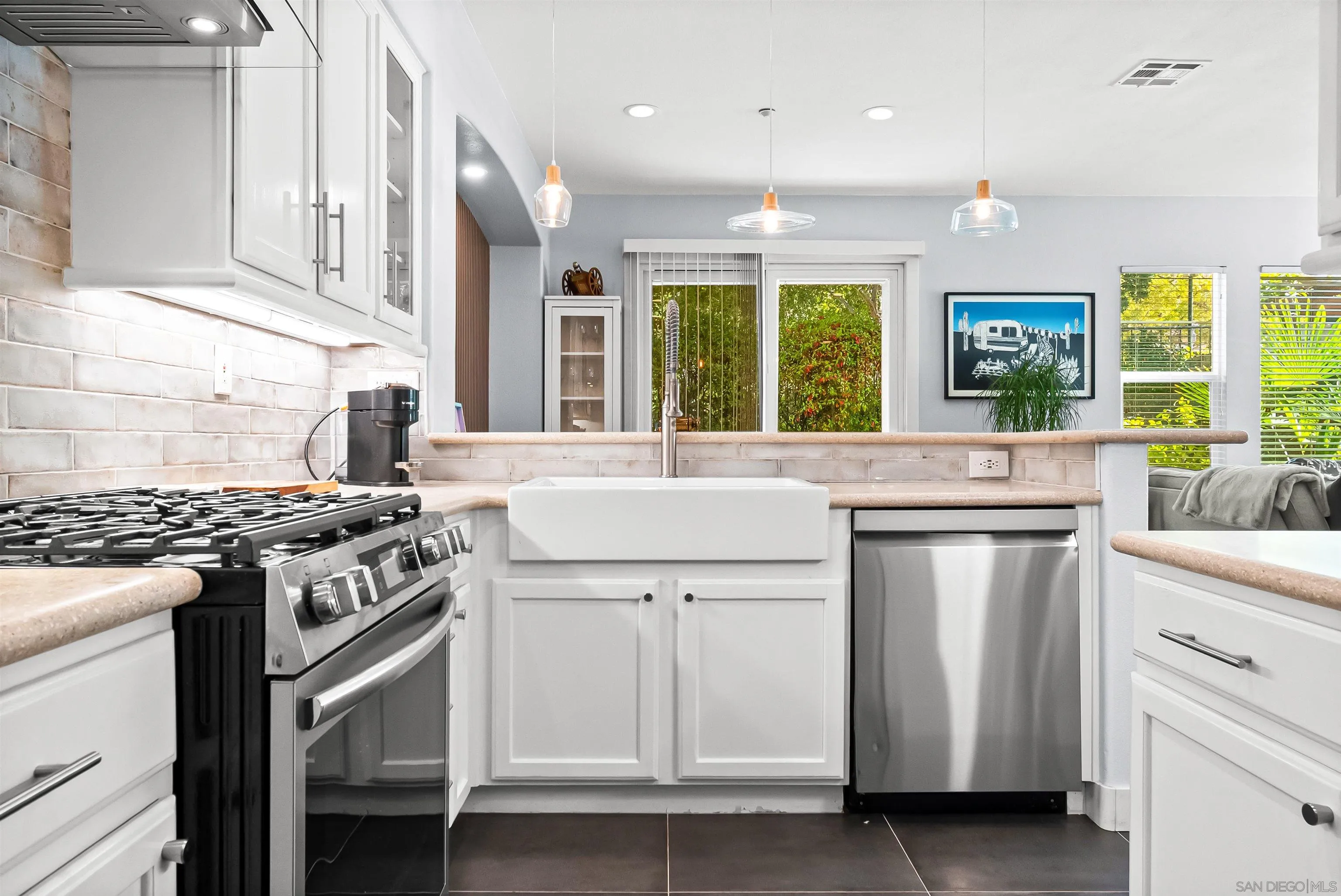 1184 Highbluff Avenue San Marcos, CA 92078 - Photo 2 of 63 a kitchen with a stove and a sink