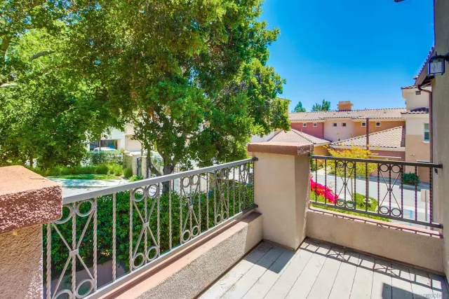 a view of a bedroom with a bed and a window