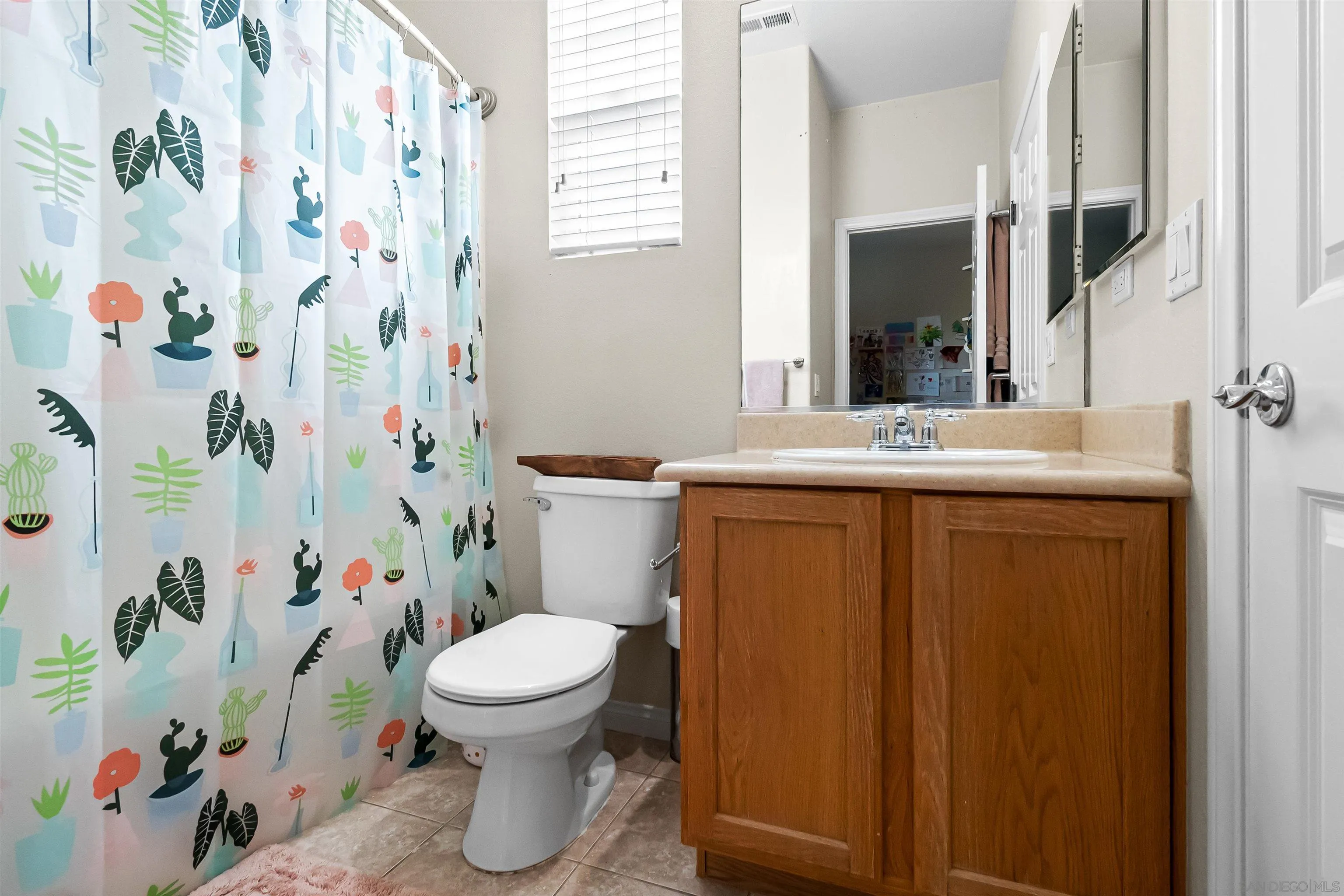1184 Highbluff Avenue San Marcos, CA 92078 - Photo 38 of 63 a bathroom with a sink toilet and shower