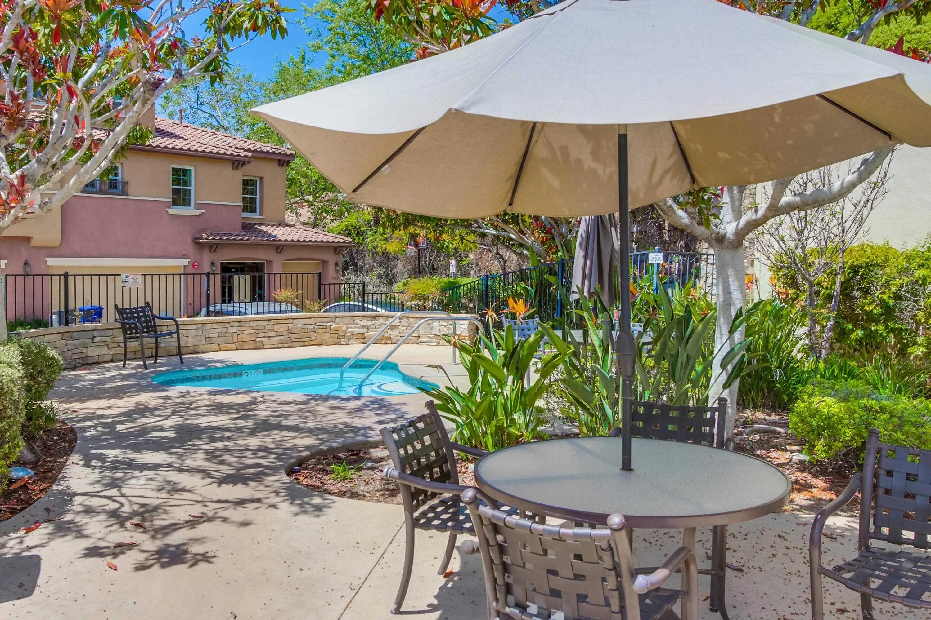 1184 Highbluff Avenue San Marcos, CA 92078 - Photo 54 of 63 a backyard of a house with barbeque oven table and chairs