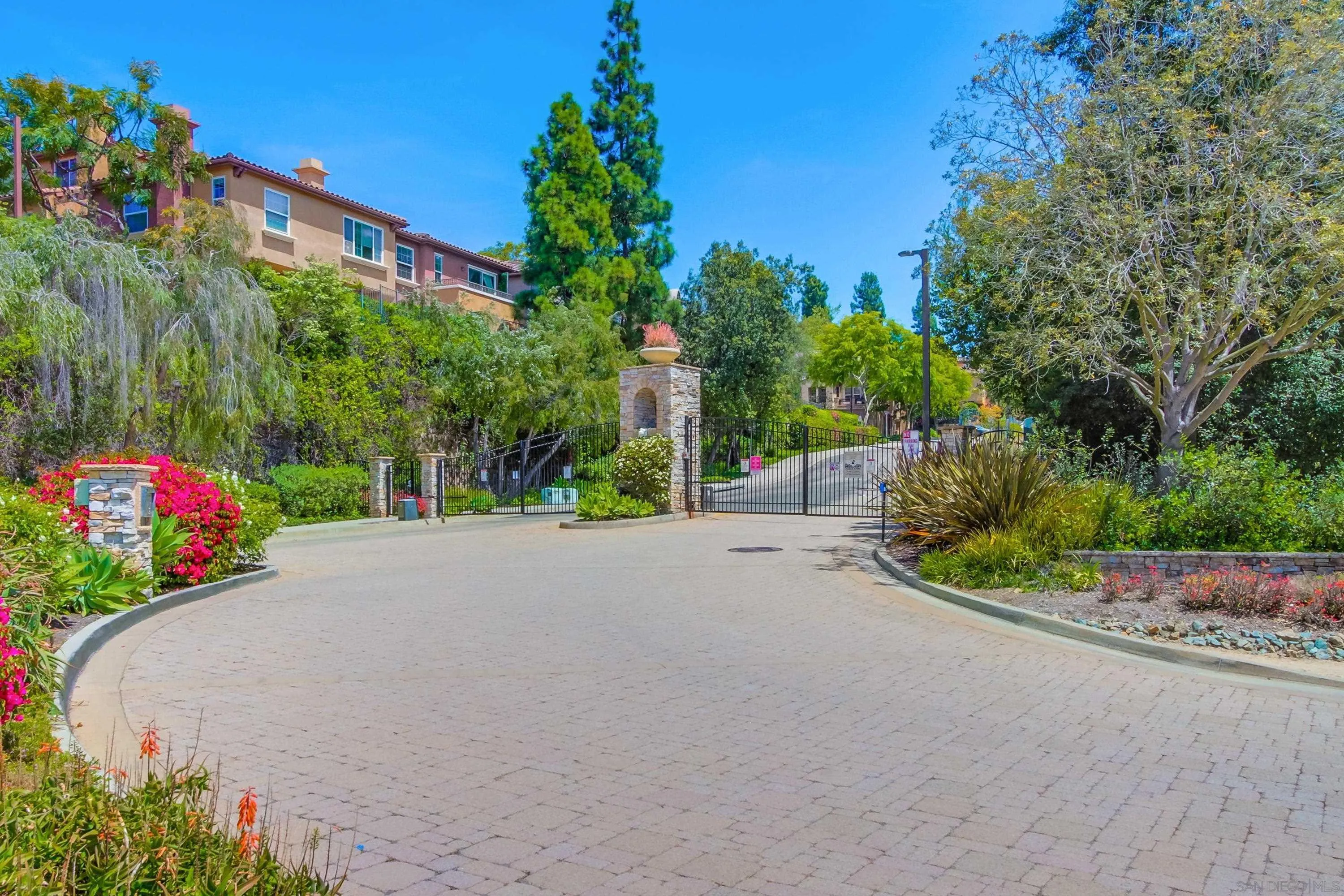 1184 Highbluff Avenue San Marcos, CA 92078 - Photo 61 of 63 a view of a street with a building and trees in the background