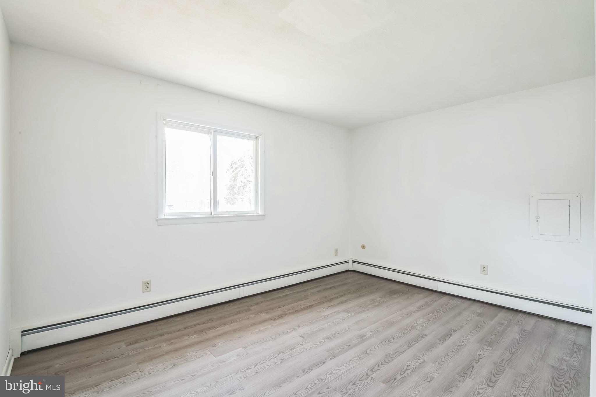 29 Stagecoach Road Southampton, NJ 08088 - Photo 19 of 40 wooden floor in an empty room with a window