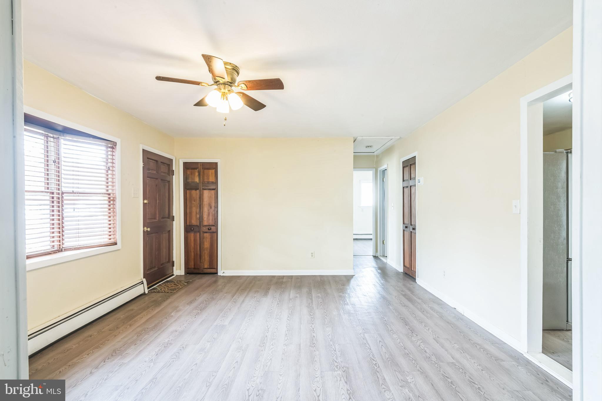 29 Stagecoach Road Southampton, NJ 08088 - Photo 4 of 40 a view of empty room with wooden floor and fan