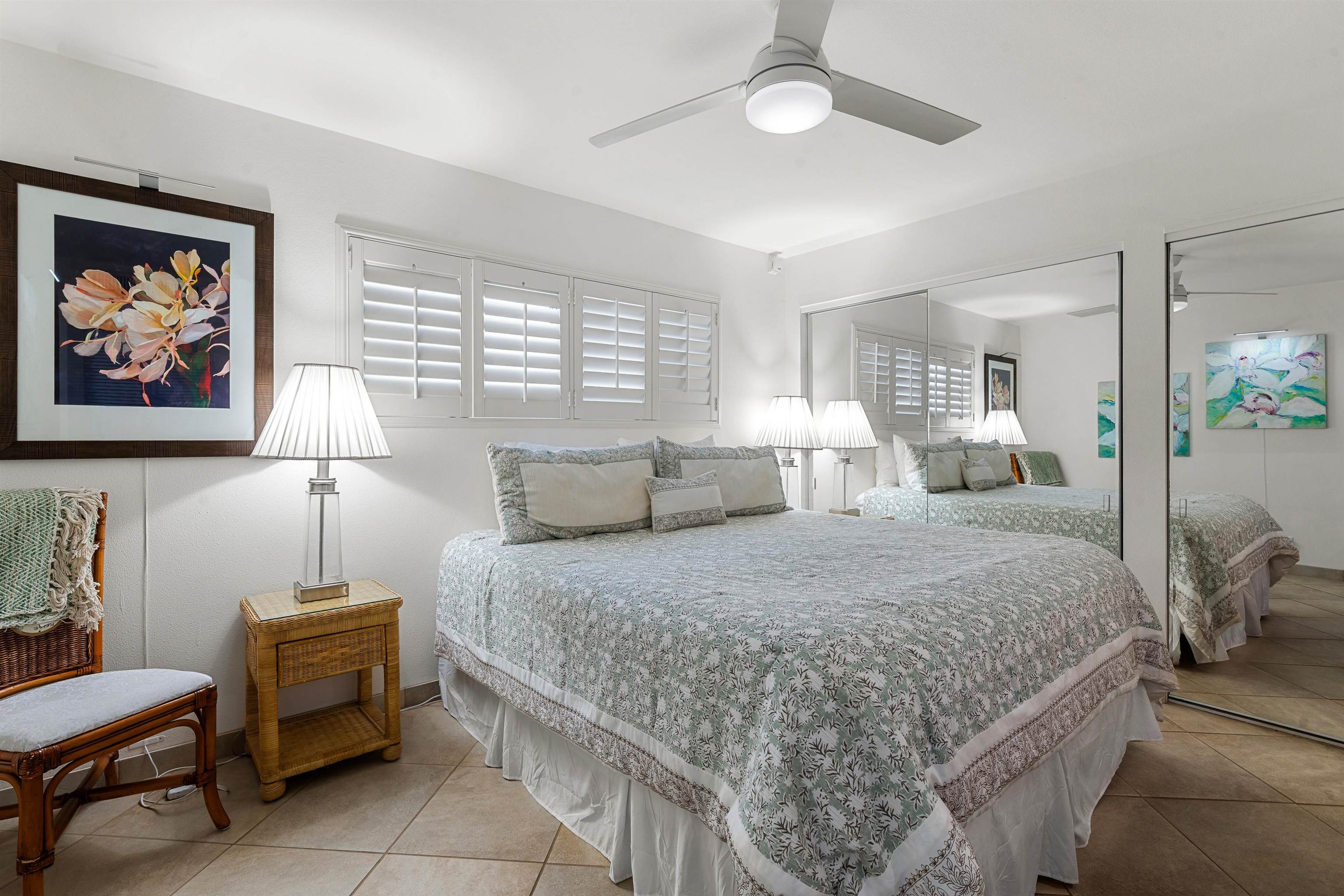 36 South Kihei Road, Unit 603 Kihei, HI 96753 - Photo 12 of 37 a bedroom with a large bed and a chandelier
