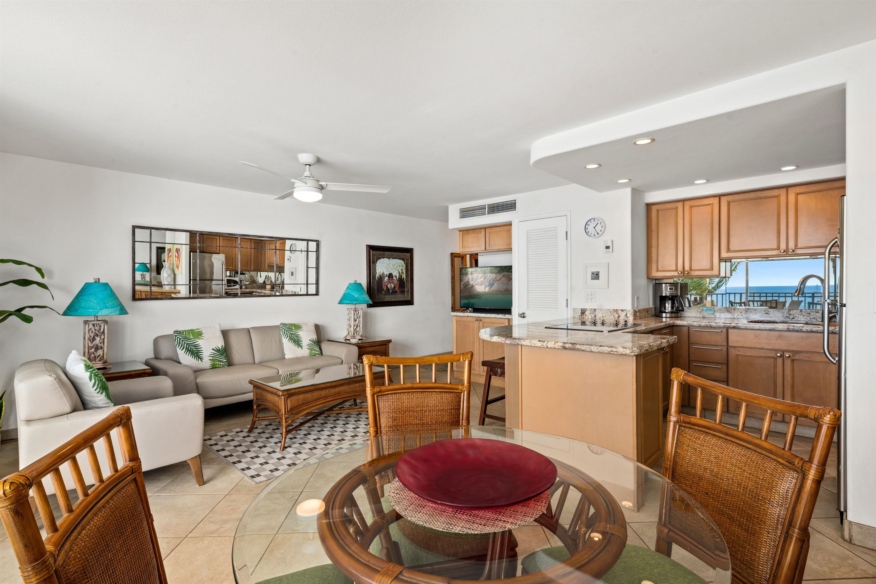 36 South Kihei Road, Unit 603 Kihei, HI 96753 - Photo 5 of 37 a living room with furniture a rug and kitchen view