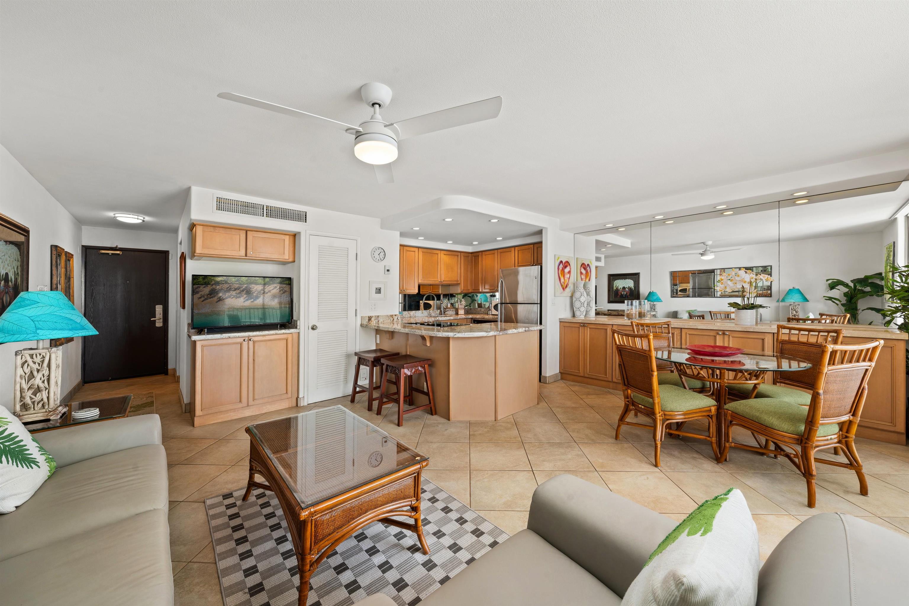 36 South Kihei Road, Unit 603 Kihei, HI 96753 - Photo 6 of 37 a living room with furniture kitchen view and a large window