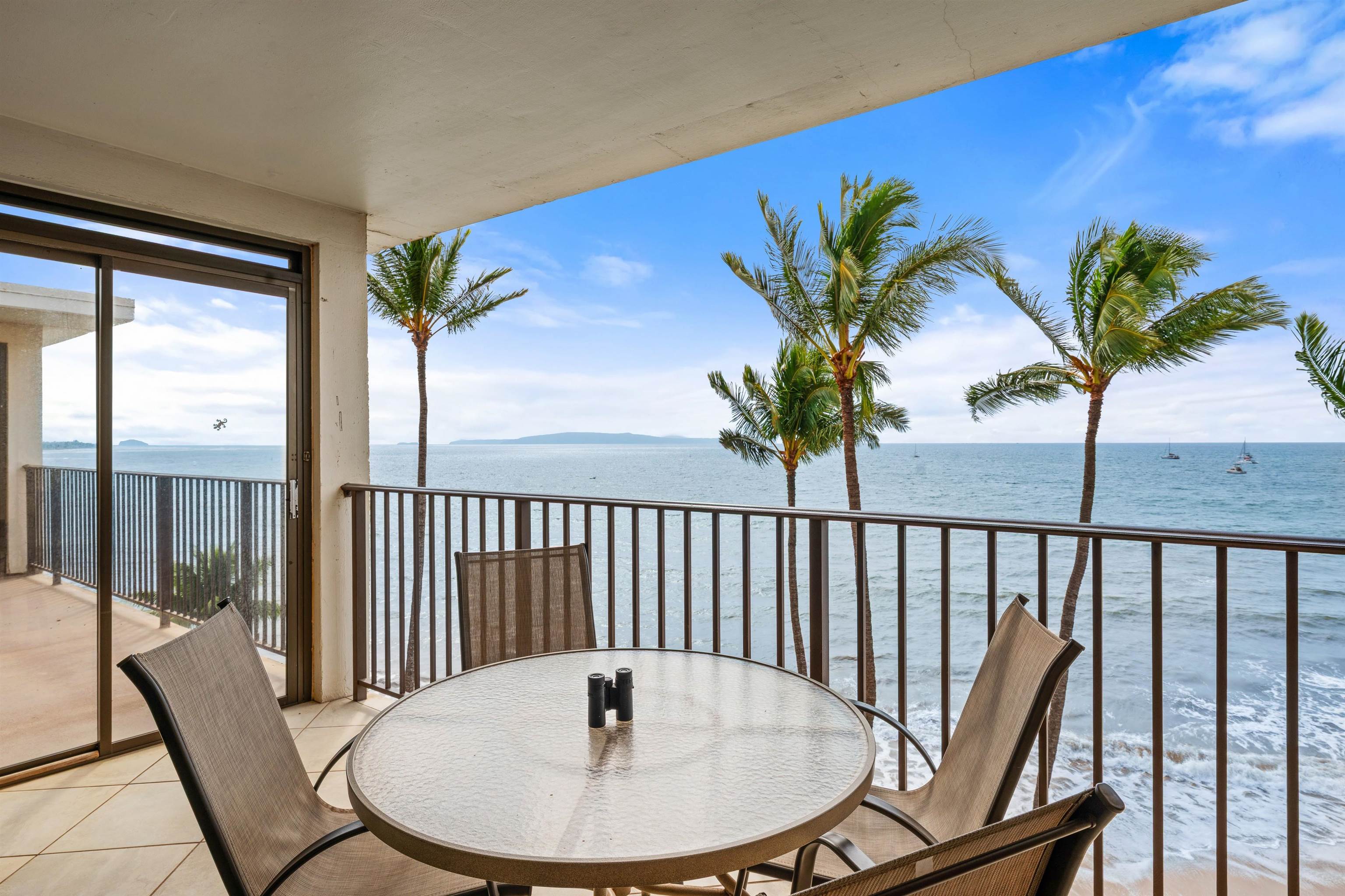 36 South Kihei Road, Unit 603 Kihei, HI 96753 - Photo 7 of 37 a view of a balcony with a table and chairs