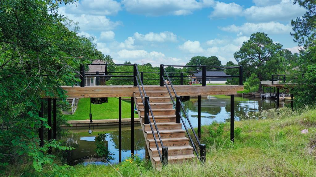 97 Hilltop Trinidad, TX 75163 - Photo 11 of 13 a view of a patio with table and chairs plants and large trees