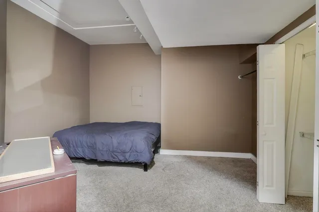 a room with a furniture and a white wall