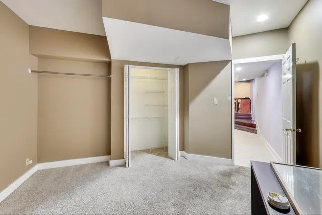 a view of a hallway with closet and entryway