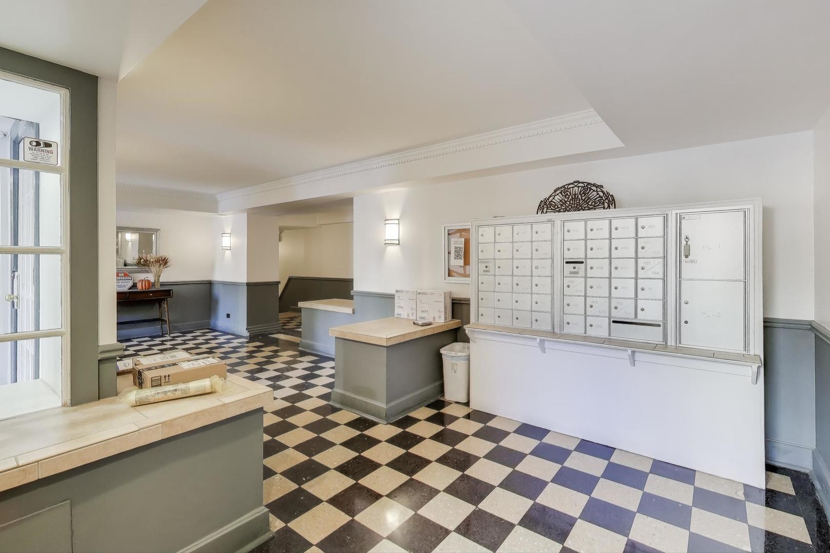 725 West Sheridan Road, Unit 10E Chicago, IL 60613 - Photo 5 of 16 a kitchen with a sink a stove a bathtub and a window