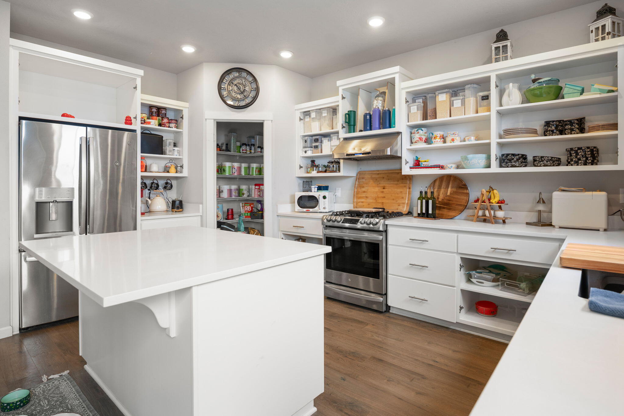 4039 Southwest Quartz Place Redmond, OR 97756 - Photo 11 of 44 a kitchen with stainless steel appliances a refrigerator and a stove top oven