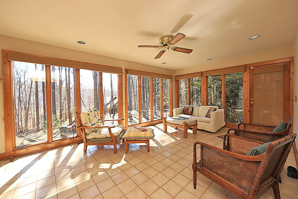 11716 Appaloosa Run East Raleigh, NC 27613 - Photo 10 of 30 Lovely light filled sunroom has floor to ceiling Anderson windows on all 3 sides and easy to maintain tile flooring. Sun Room