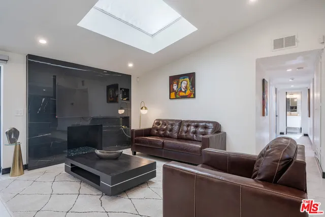 a living room with furniture and a couch