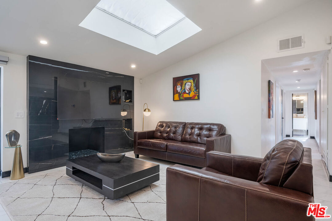 20412 Oxnard Street Woodland Hills, CA 91367 - Photo 20 of 35 a living room with furniture and a couch