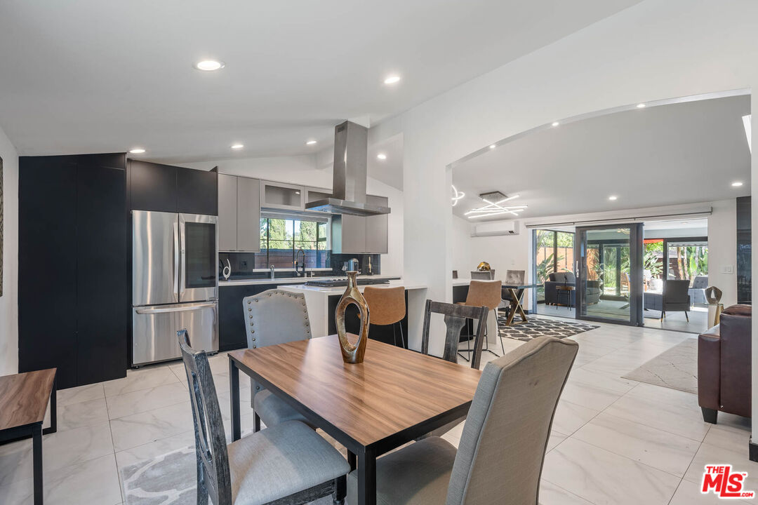 20412 Oxnard Street Woodland Hills, CA 91367 - Photo 2 of 35 a view of a dining room with furniture
