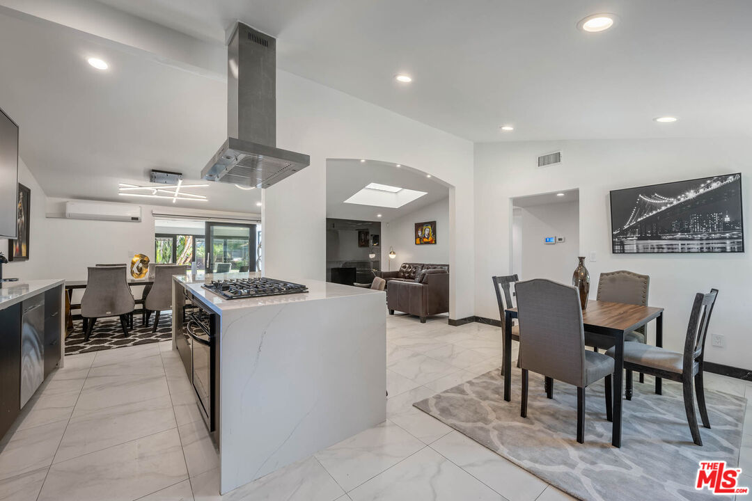 20412 Oxnard Street Woodland Hills, CA 91367 - Photo 27 of 35 a large kitchen with a table and chairs in it