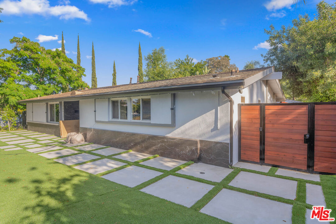 20412 Oxnard Street Woodland Hills, CA 91367 - Photo 35 of 35 a view of a house with a patio