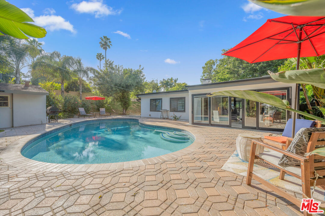 20412 Oxnard Street Woodland Hills, CA 91367 - Photo 7 of 35 a view of a house with backyard and sitting area