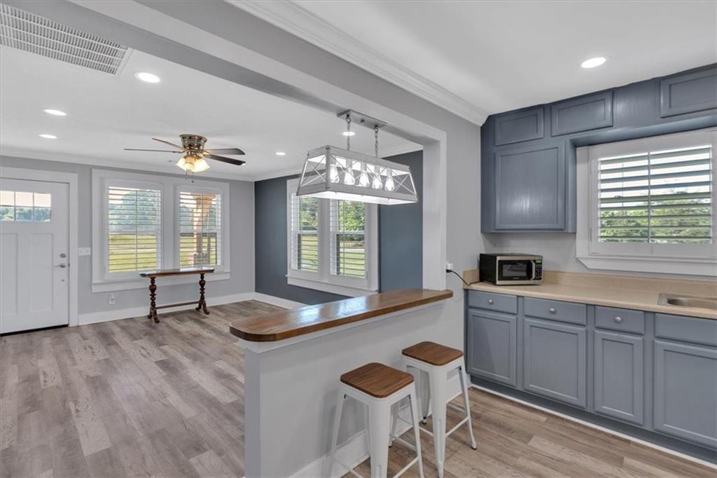 3049 Highway 411 White, GA 30184 - Photo 15 of 49 a kitchen with granite countertop a sink cabinets and window