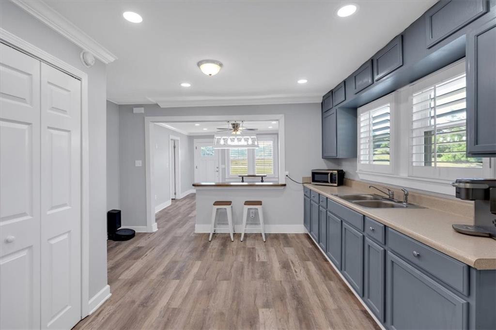3049 Highway 411 White, GA 30184 - Photo 17 of 49 a large kitchen with a lot of counter space and a wooden floor