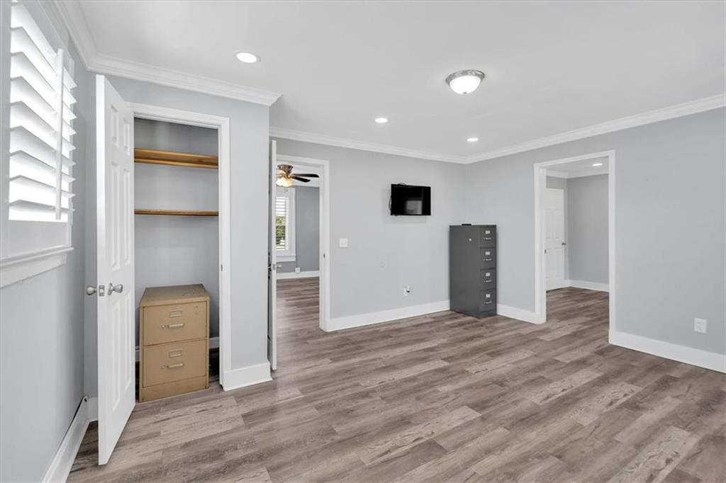 3049 Highway 411 White, GA 30184 - Photo 22 of 49 a view of an empty room with wooden floor and windows