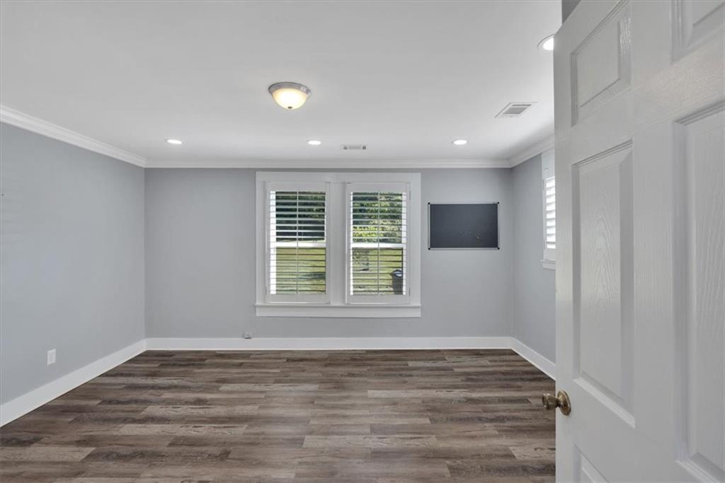 3049 Highway 411 White, GA 30184 - Photo 23 of 49 a view of an empty room with wooden floor and a window
