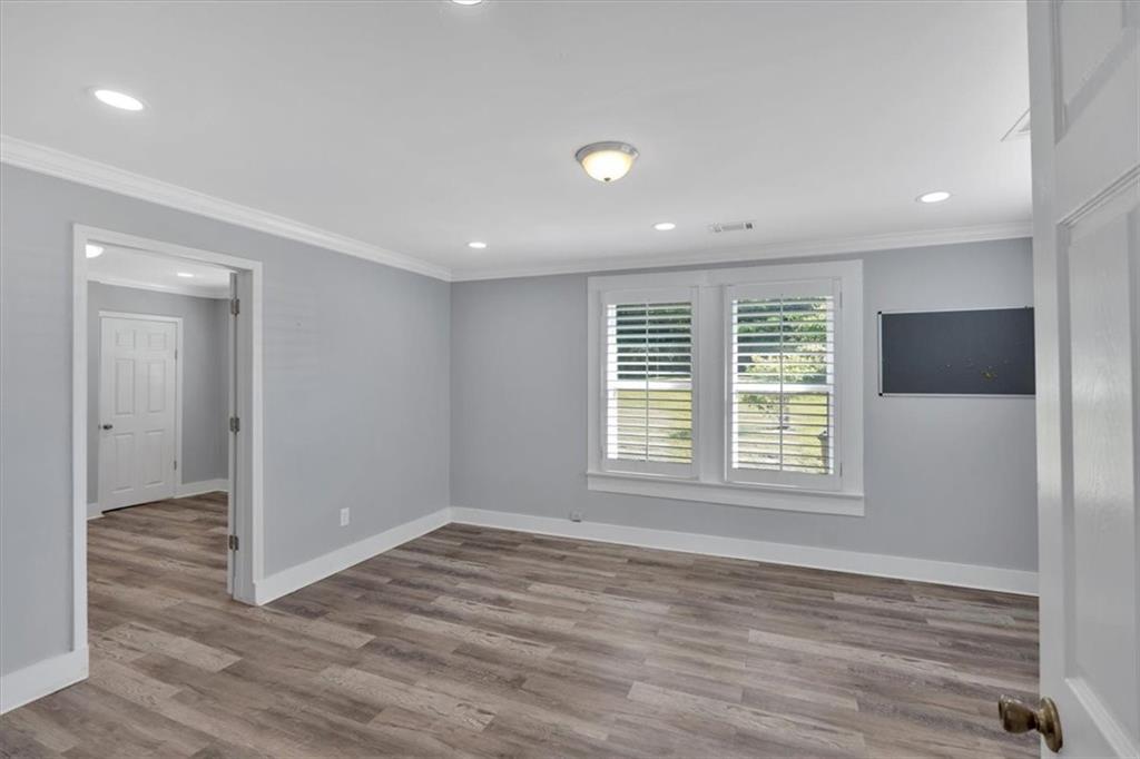 3049 Highway 411 White, GA 30184 - Photo 24 of 49 a view of an empty room with wooden floor and a window