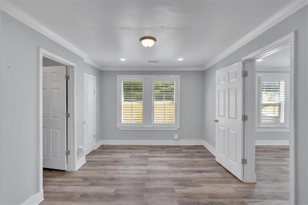 3049 Highway 411 White, GA 30184 - Photo 27 of 49 a view of an empty room with wooden floor and a window