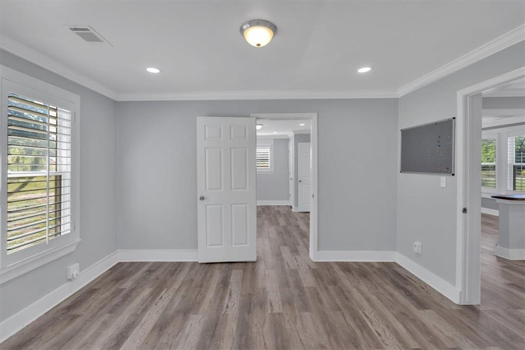 3049 Highway 411 White, GA 30184 - Photo 28 of 49 a view of an empty room with wooden floor and a window