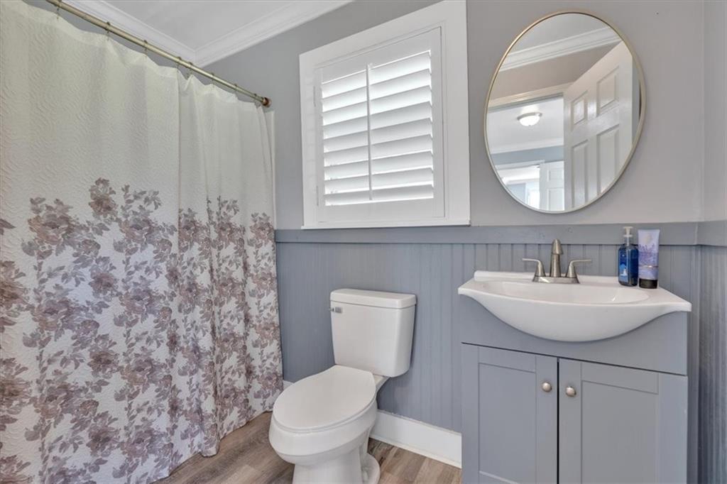 3049 Highway 411 White, GA 30184 - Photo 30 of 49 a bathroom with a toilet sink and mirror