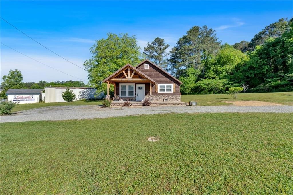 3049 Highway 411 White, GA 30184 - Photo 3 of 49 a front view of a house with a yard